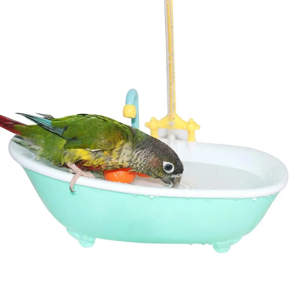 Green parrot using an automatic plastic bird bathtub with running water faucet for fun, refreshing bathing.