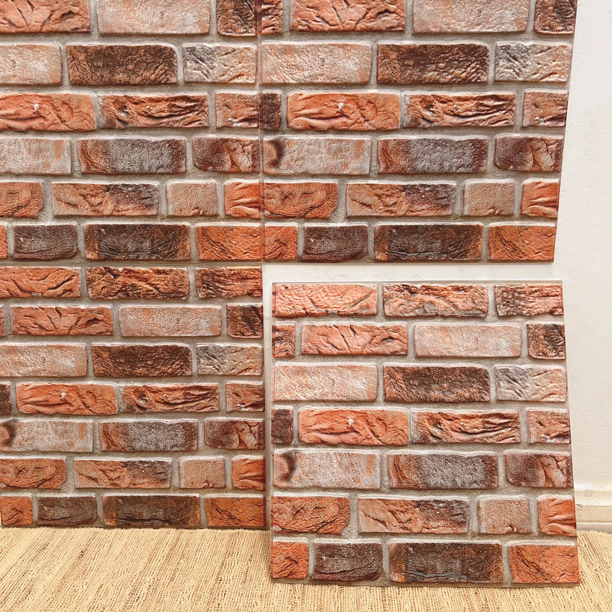 Peel-and-stick brick backsplash tiles, terracotta and brown textured stone look