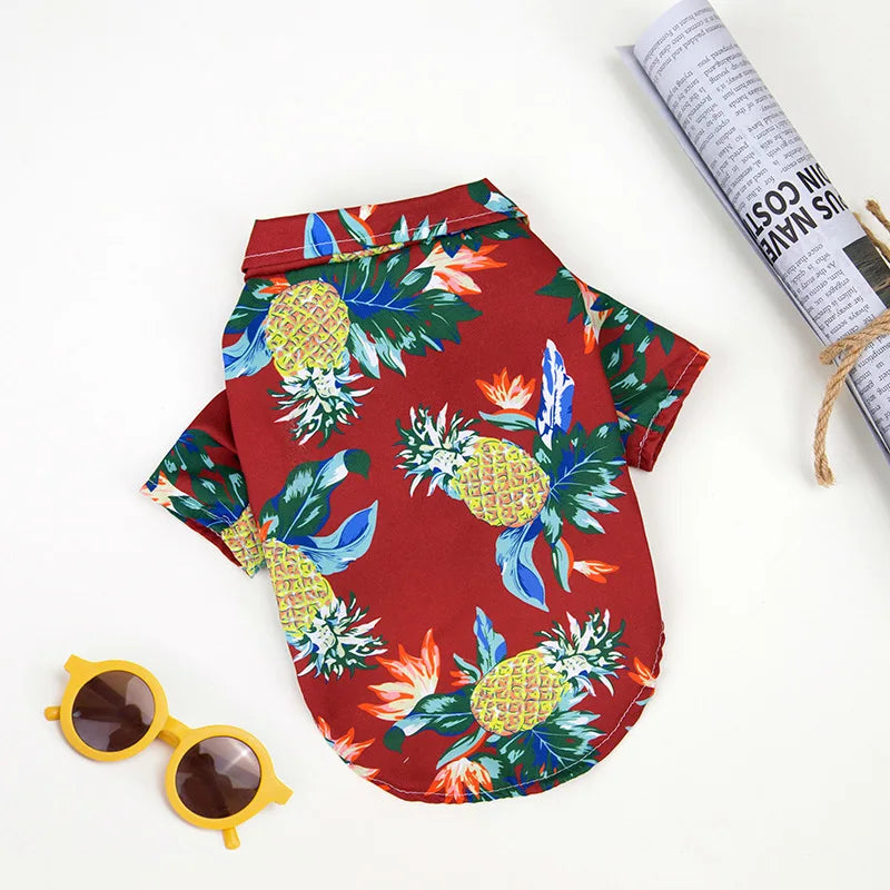 Red Hawaiian pineapple print dog shirt for summer. Breathable, comfortable pet clothing available in sizes XS to 5XL.