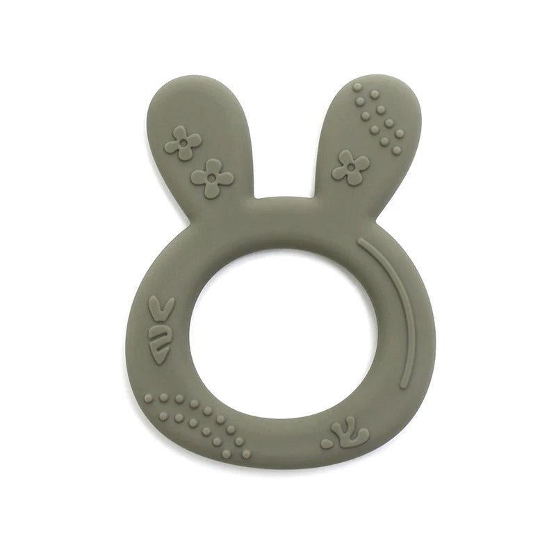 Sage green silicone teething ring for baby, featuring a cute bunny shape for soothing relief.