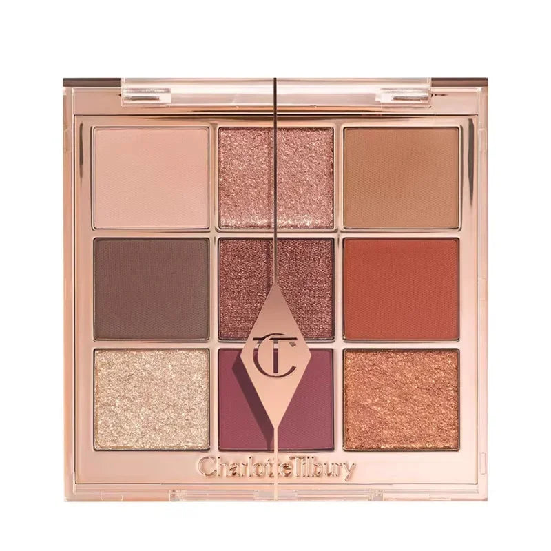 Tidesmit 9 color rose pink eyeshadow palette featuring pearly matte and glitter makeup finishes texture close-up