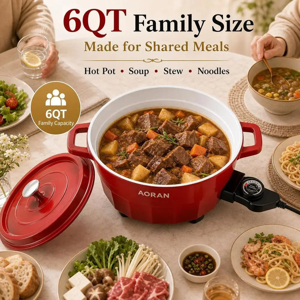 Red electric hot pot cooker with lid, side handles, and simmering stew inside