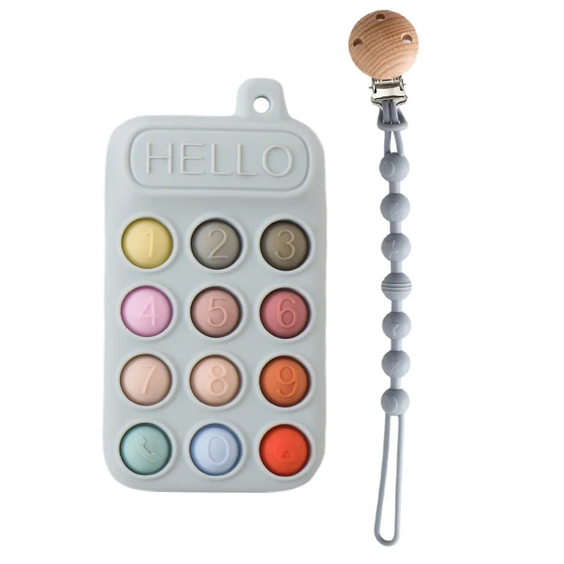 Multi-colored silicone baby teething toy with phone design and grey pacifier clip.