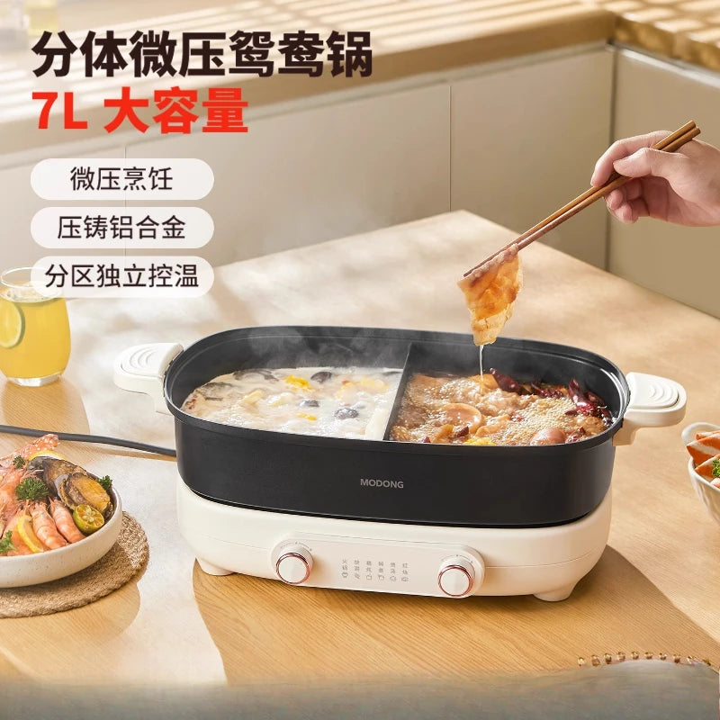MODONG electric hot pot with black cooking pot, lid, and chopsticks serving food