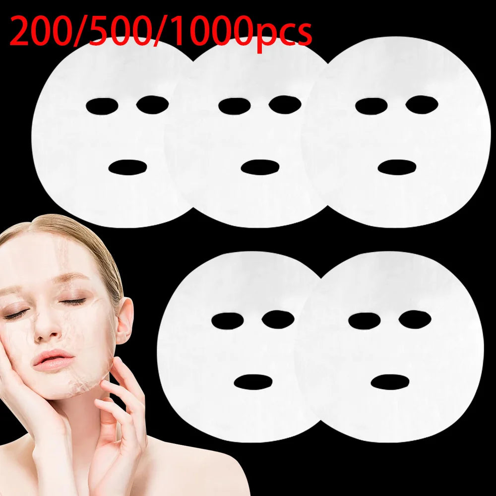 A woman applying a thin, transparent, white sheet mask, with several other unused circular sheet masks displayed above.