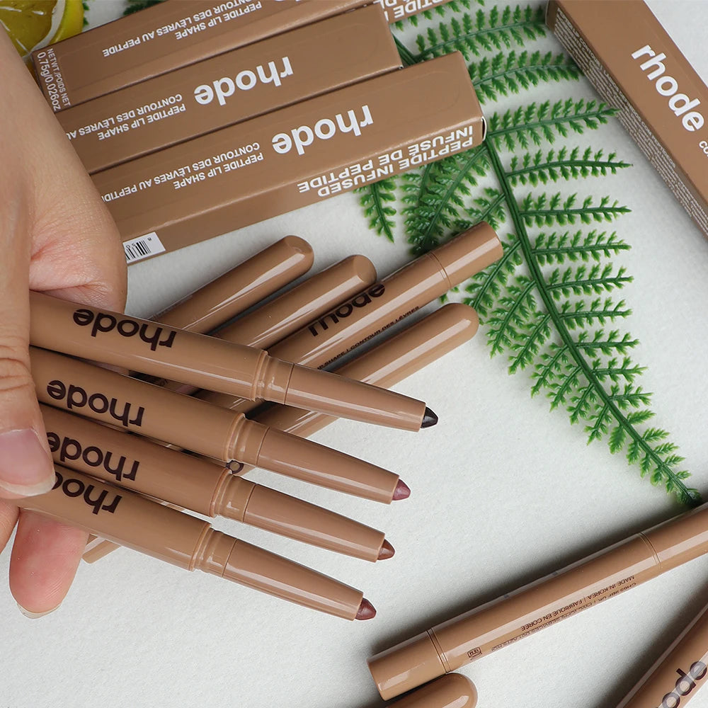 Rhode Peptide Lip Shape pencil liners in various nude shades with matching beige packaging and boxes.