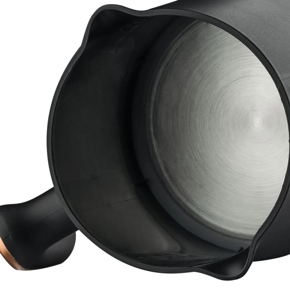 Interior view of black electric coffee maker with a durable stainless steel heating base.