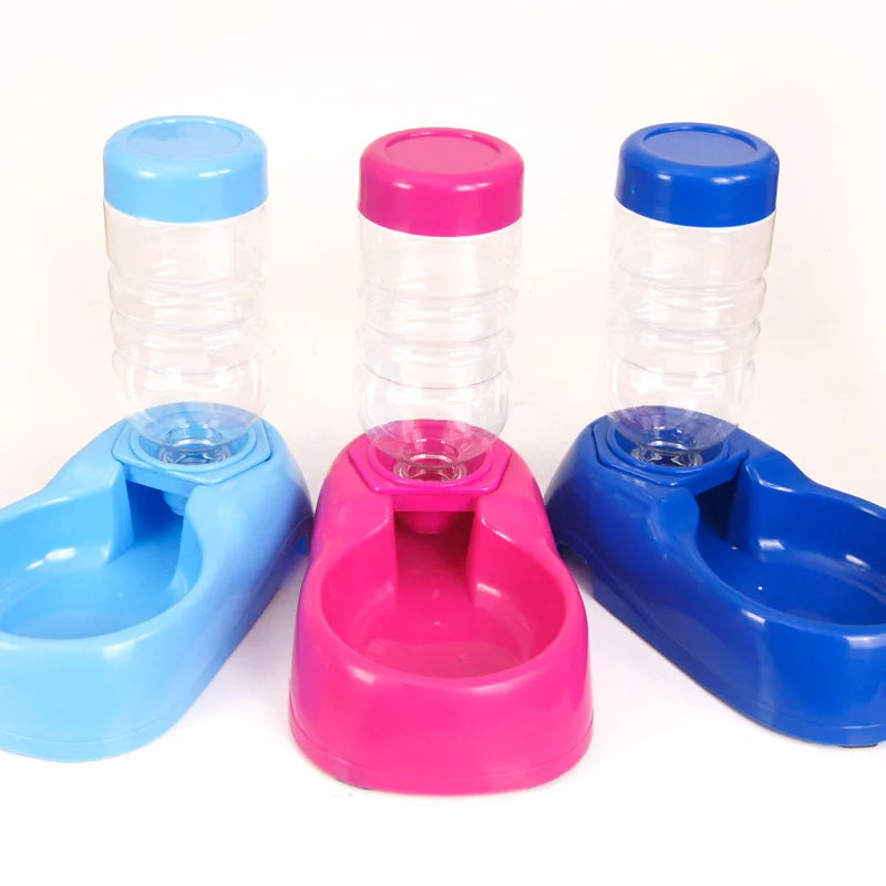 Colorful automatic water dispensers for cats and dogs with plastic refillable bottles for easy hydration.