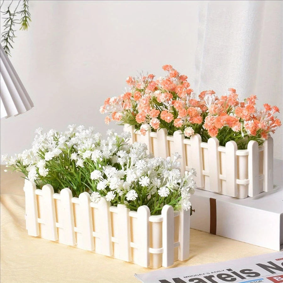 Set of white fence-style rectangular planters with white and orange flowers