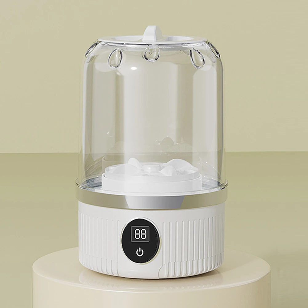 Tidesmit cordless mini washing machine for baby clothes featuring automatic laundry cup and rechargeable design.