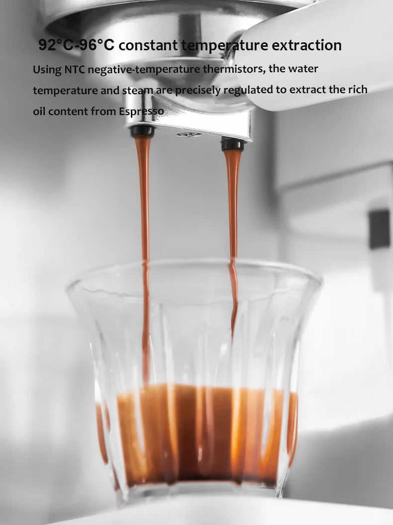 Espresso machine pouring fresh coffee into a small clear glass, featuring metal portafilter and temperature control.