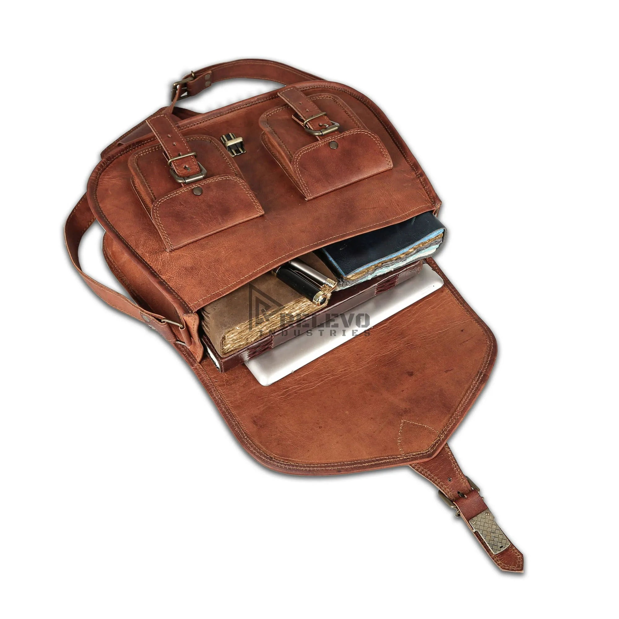 Large brown leather satchel with dual front pockets, buckle straps, and spacious interior, ideal as a travel handbag.