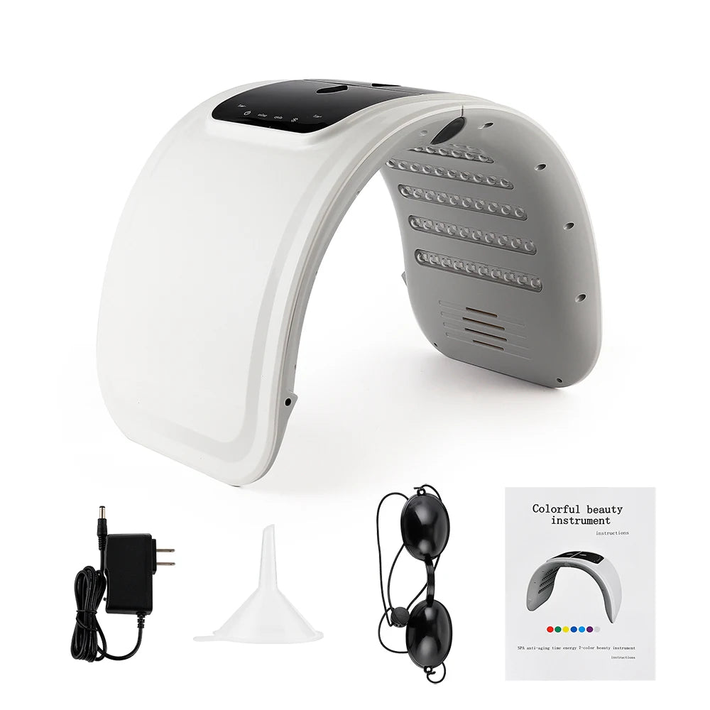 White arched LED light therapy machine for skincare with protective goggles, power adapter, funnel, and manual.