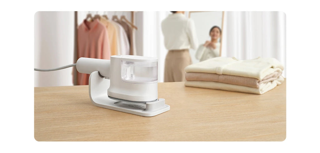 Tidesmit portable handheld garment steamer for clothes showing the steam nozzle and handle design for vertical ironing