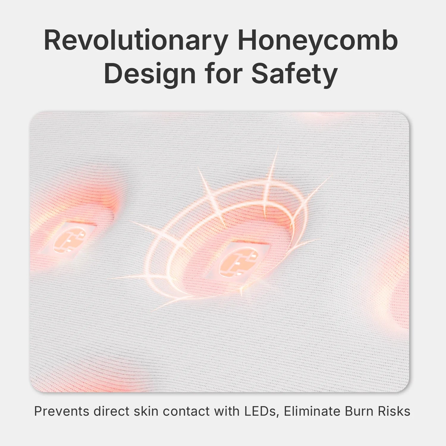 Close-up of a white, textured red light therapy mat featuring a honeycomb pattern with recessed, glowing LED lights.
