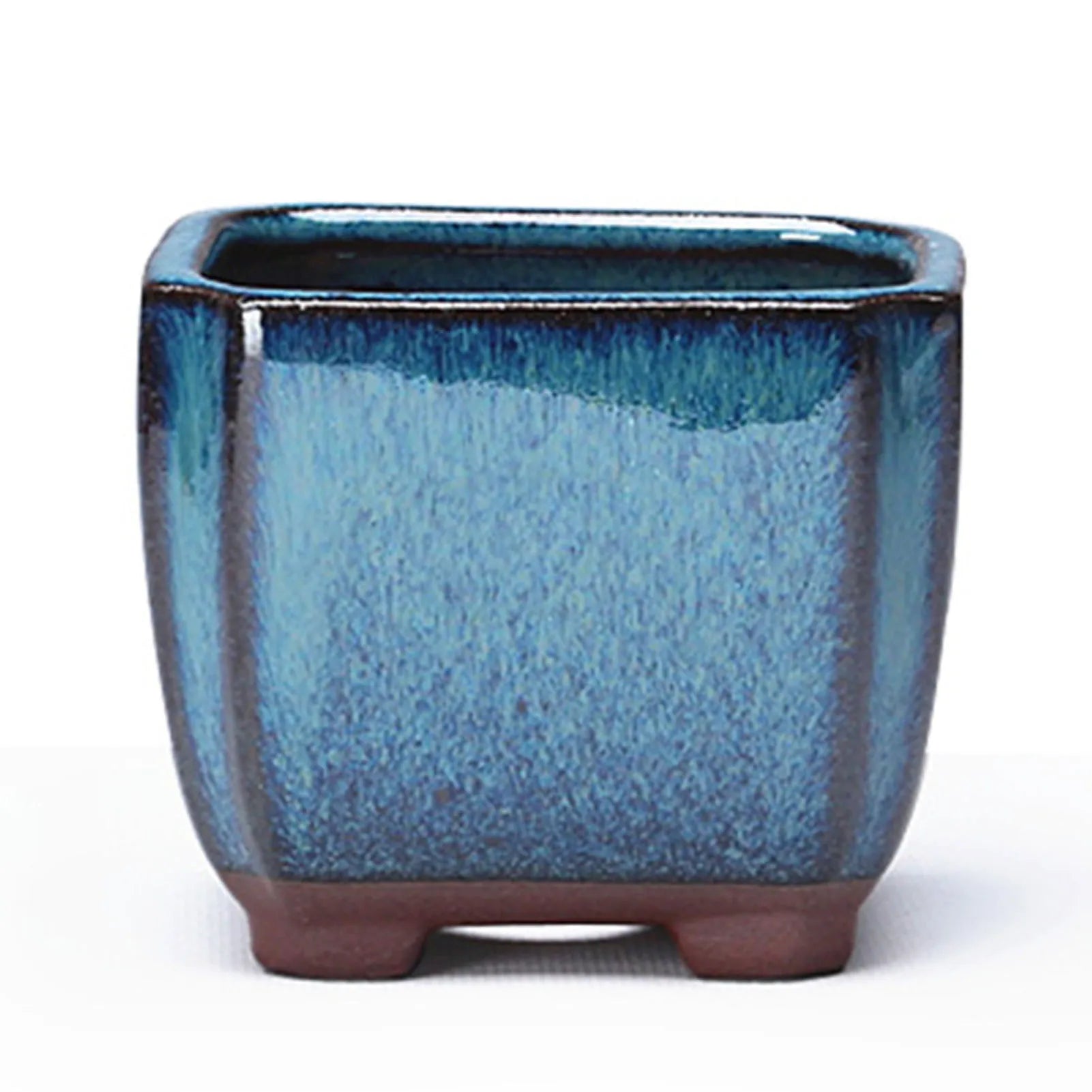 Blue ceramic succulent pot front view with terracotta base feet and open top