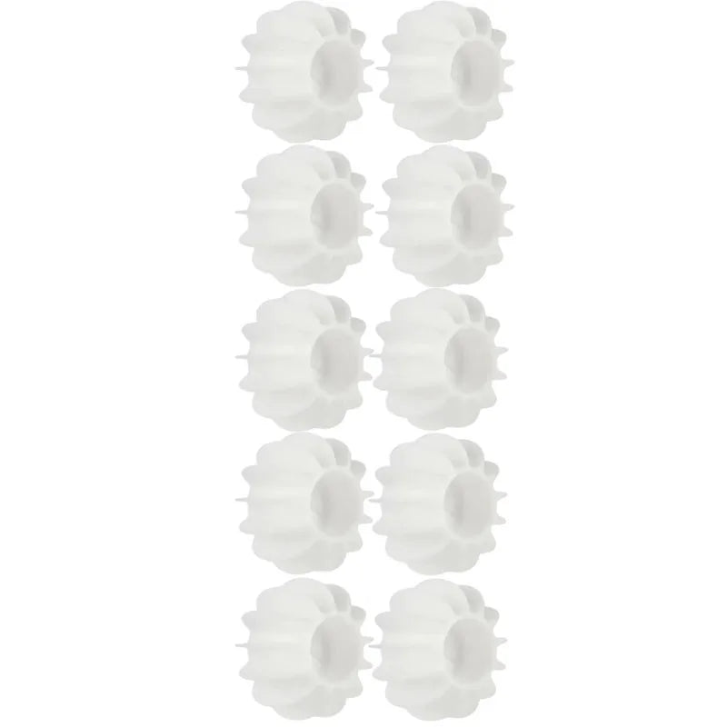 Reusable white silicone laundry balls for removing pet and cat hair in the washing machine.