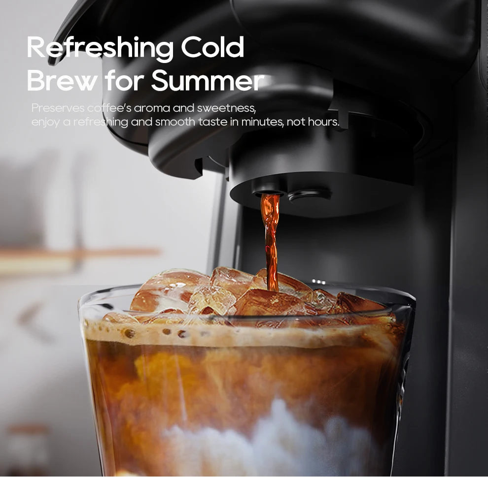 Black cold brew coffee maker pouring fresh coffee into a glass filled with ice and milk.