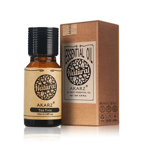 Tea tree essential oil bottle and cardboard box, amber glass with black cap
