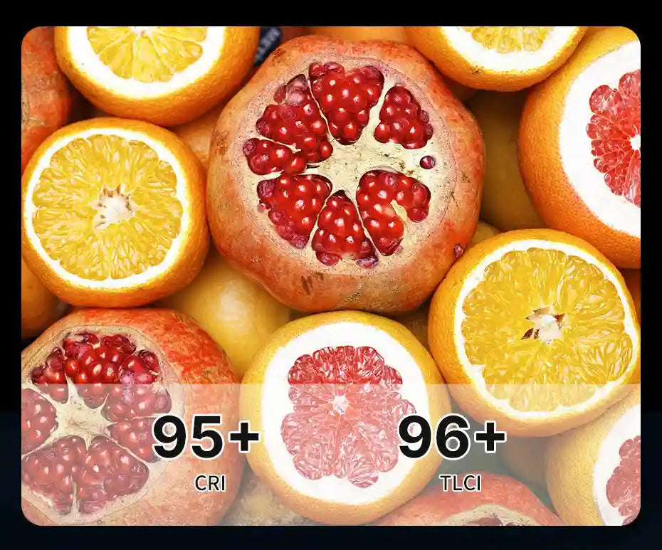 Close-up of halved pomegranates and oranges with text overlays showing 95+ CRI and 96+ TLCI ratings for light quality.