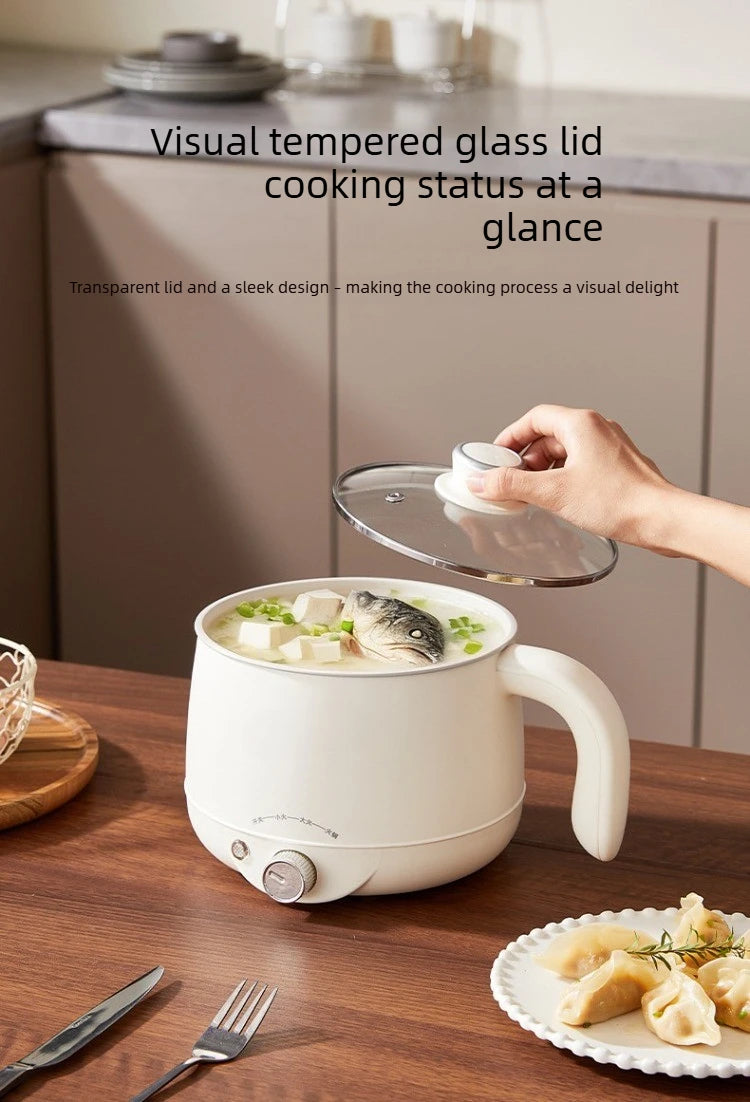 White electric multi cooker with clear glass lid and handle on countertop
