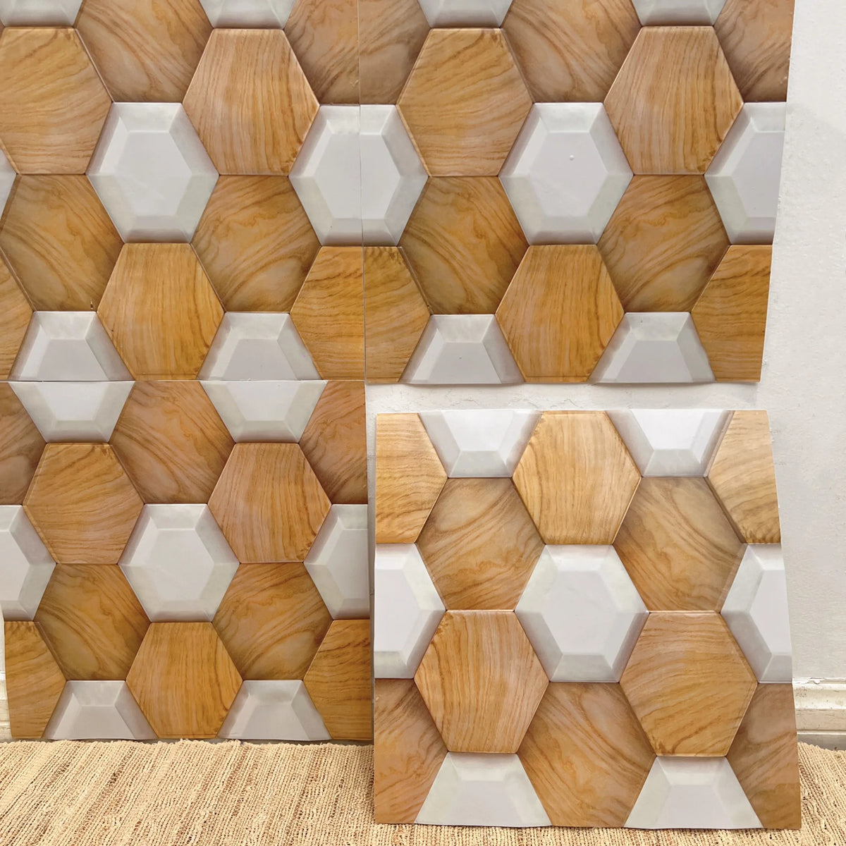 Peel-and-stick hexagon backsplash tiles in white and light wood tones