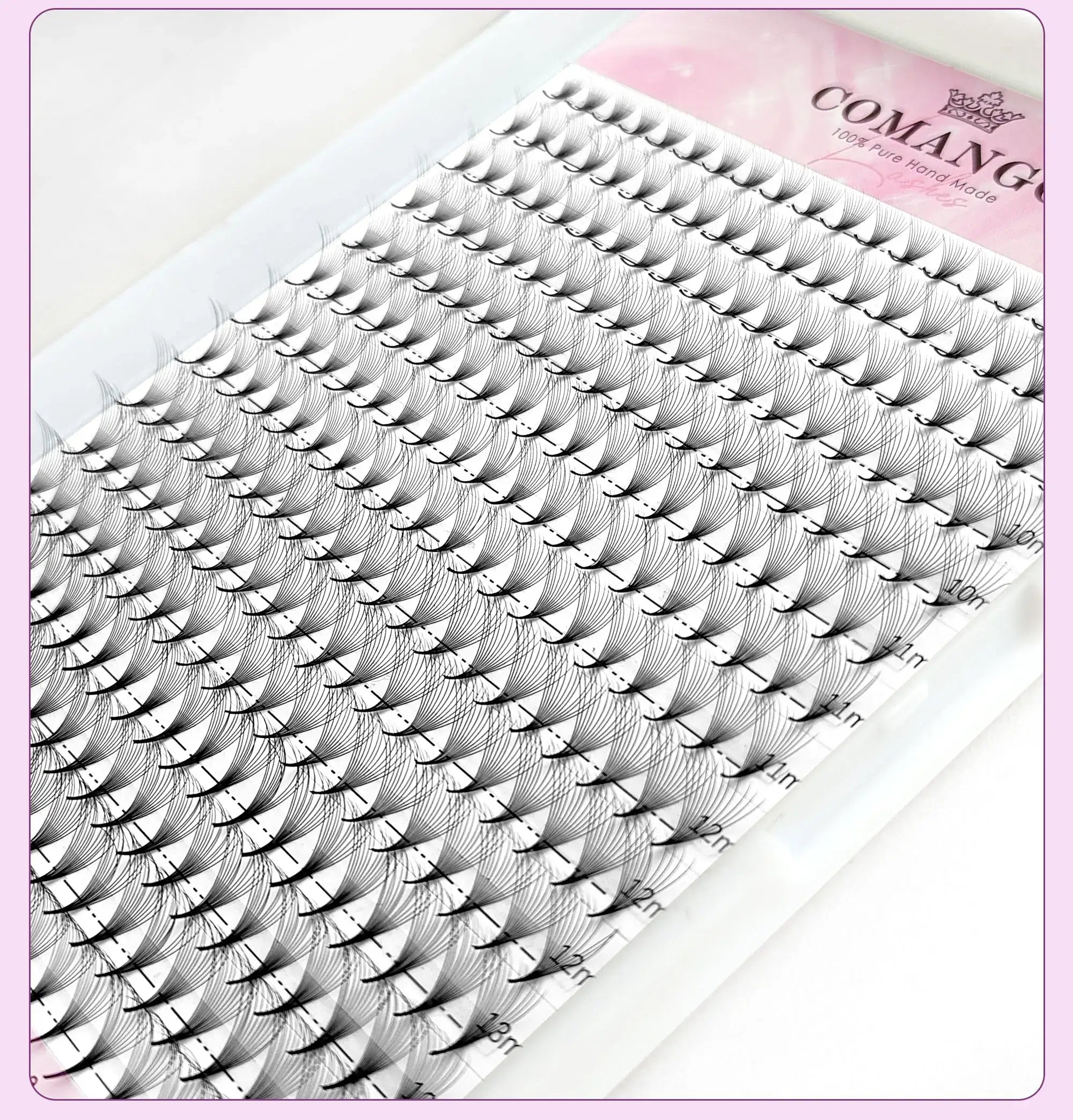Tray of black, pre-made volume eyelash fan extensions in varied lengths for professional cosmetic application.