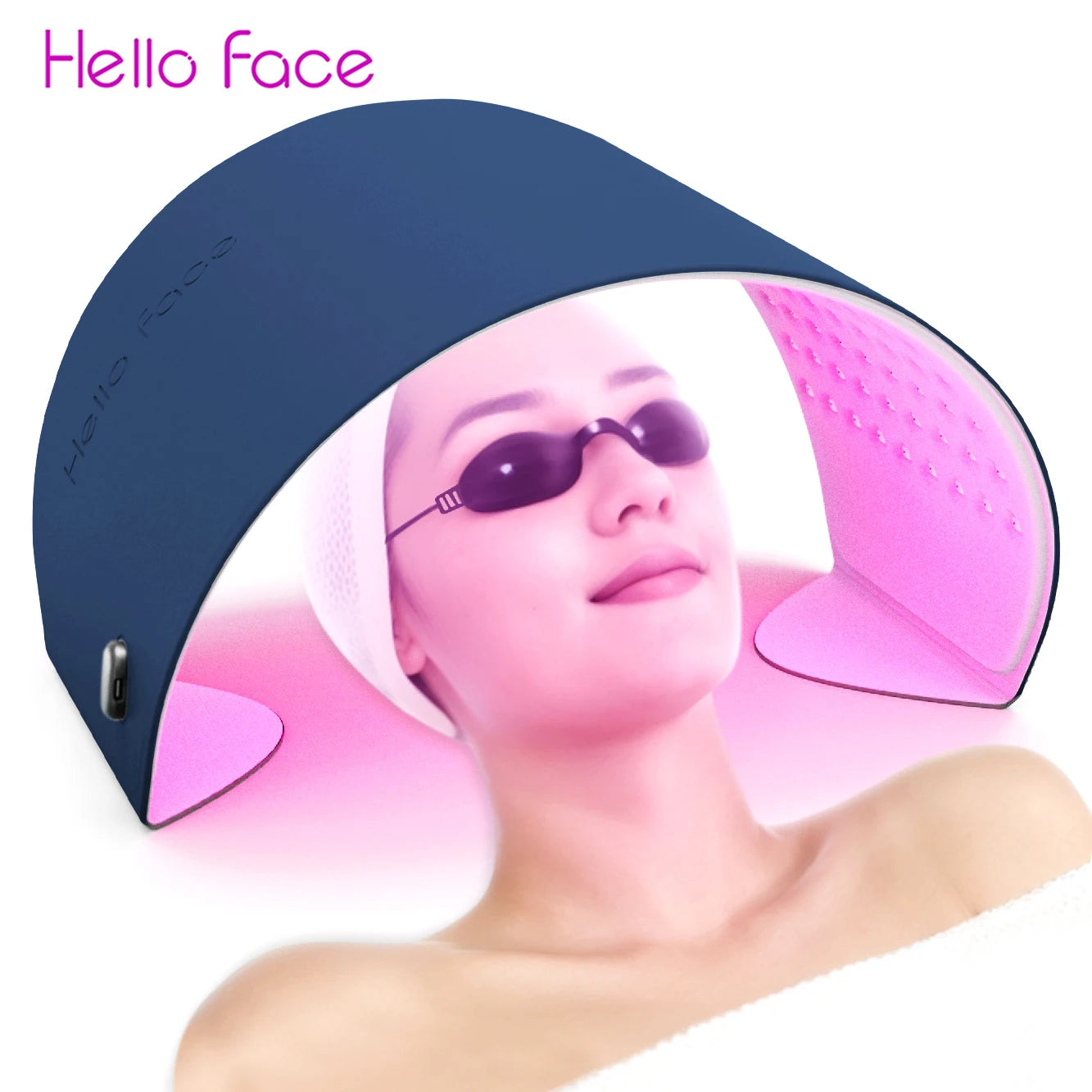 A navy blue, arched LED light therapy device placed over a woman wearing protective goggles and a headband.