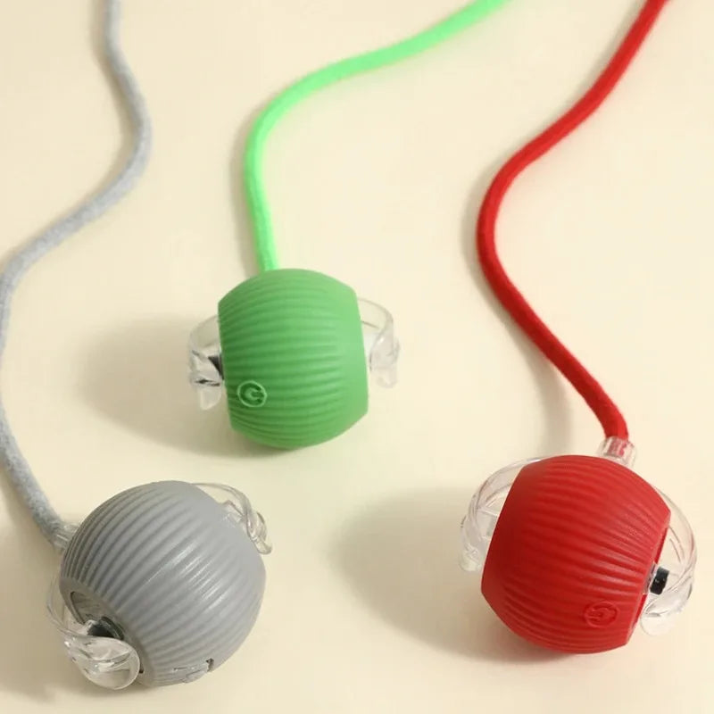 Rechargeable smart interactive ball toys for cats and dogs in red, green, and grey for automatic rolling play.