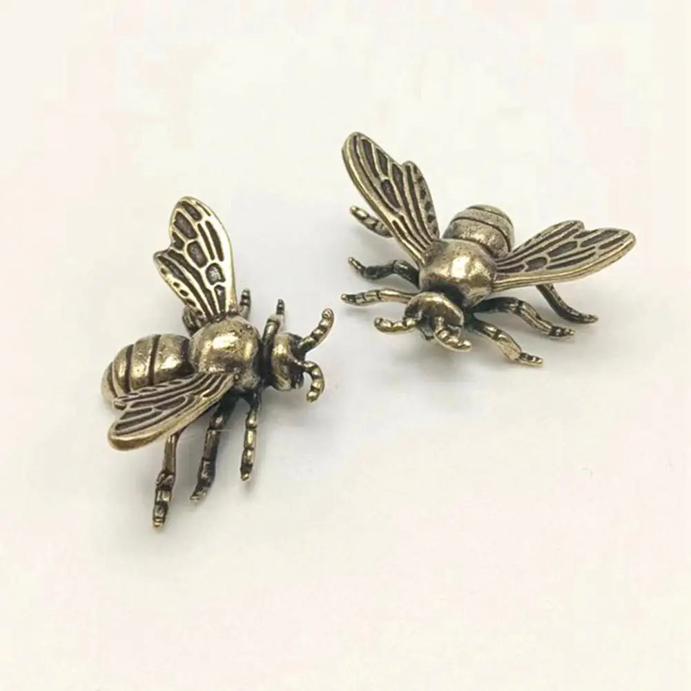 Two realistic solid brass bee figurines for tea pet decor or desk ornamentation, featuring a detailed golden metal design.