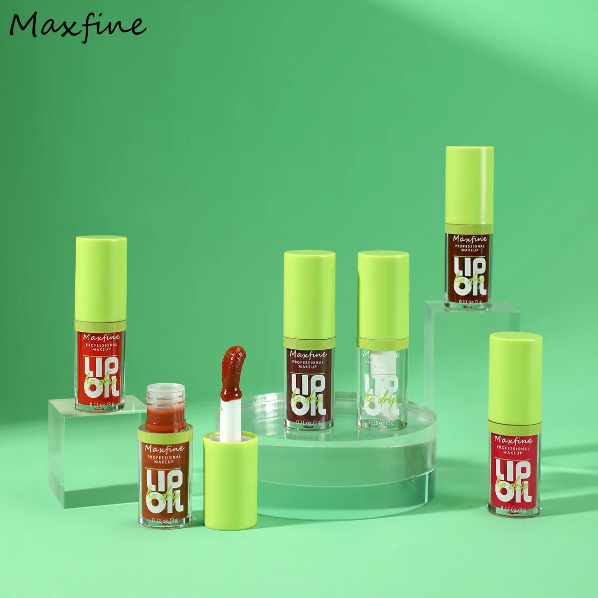 Maxfine waterproof hydrating lip oil collection with high-shine tinted gloss and applicator on green background.
