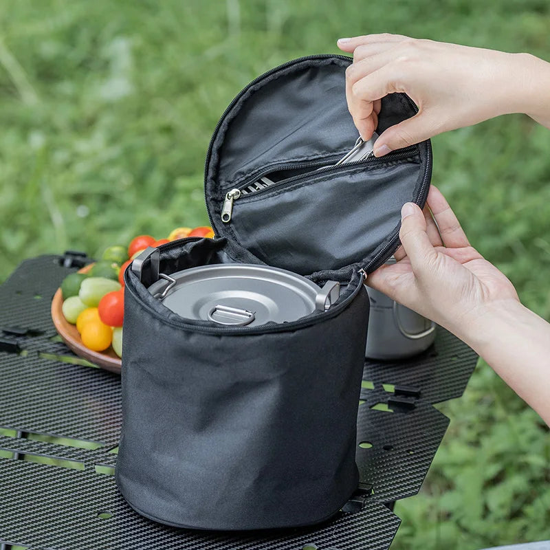 Titanium camping cookware pot stored in a black carry pouch with zipper