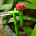 Green drip irrigation hose with adjustable micro dripper and red control cap