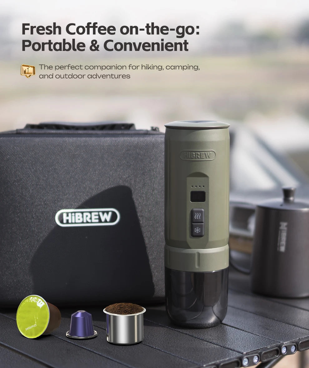 HiBREW portable olive green coffee maker with travel case, pods, and ground coffee adapter for outdoor brewing.