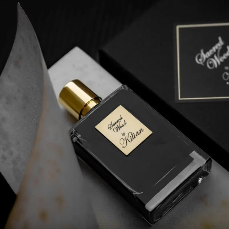 Kilian Sacred Wood unisex EDP: 50ml woody spicy niche fragrance in a sleek black square bottle with gold cap and label.
