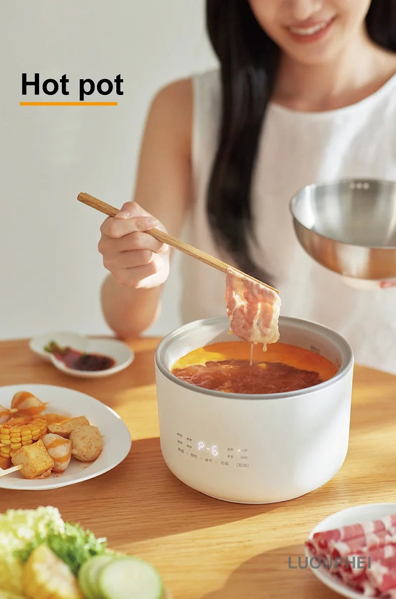1.5L electric hot pot with soup in inner tank, serving with chopsticks at table