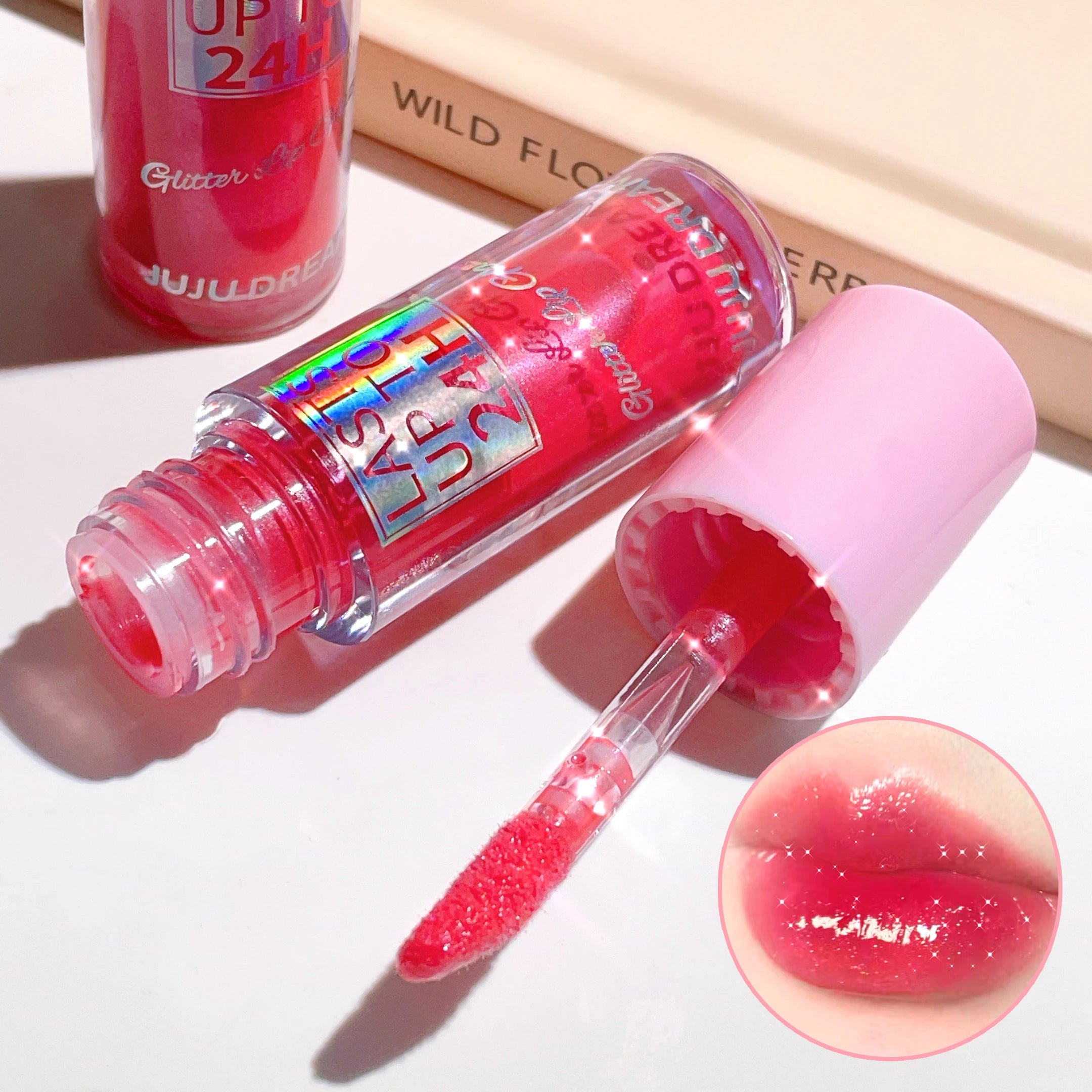 Long-lasting, waterproof glitter lip glaze in bright pink with high-shine, moisturizing liquid lipstick finish.