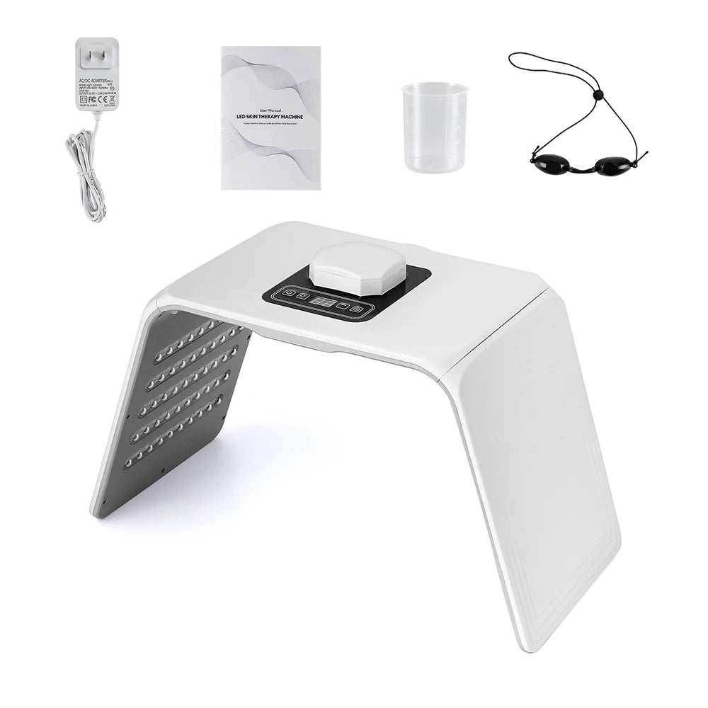 White LED skin therapy machine with arched panel, touch controls, power adapter, measuring cup, and protective goggles.