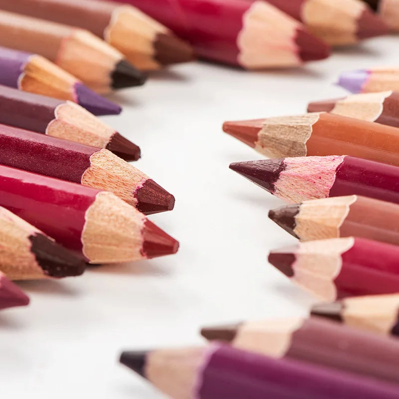 Set of waterproof velvet matte lip liner and eyeshadow pencils in various shades of red, purple, and brown.