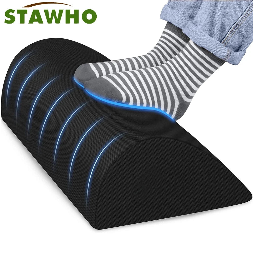 Ergonomic black memory foam under-desk foot rest with non-slip base for office fatigue relief and comfort.