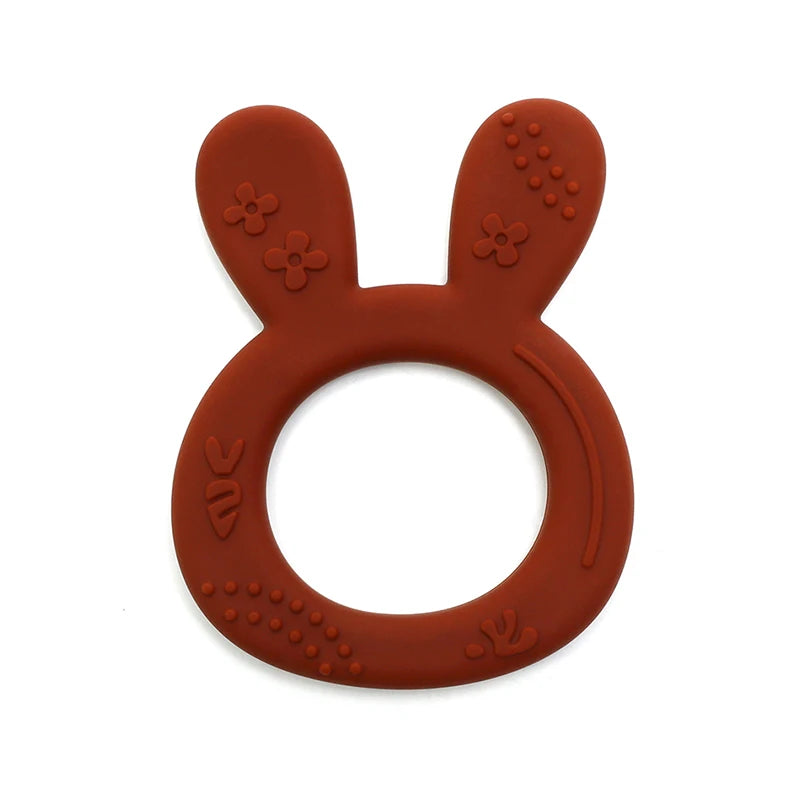 Rust-colored silicone rabbit teething ring for baby teething relief.