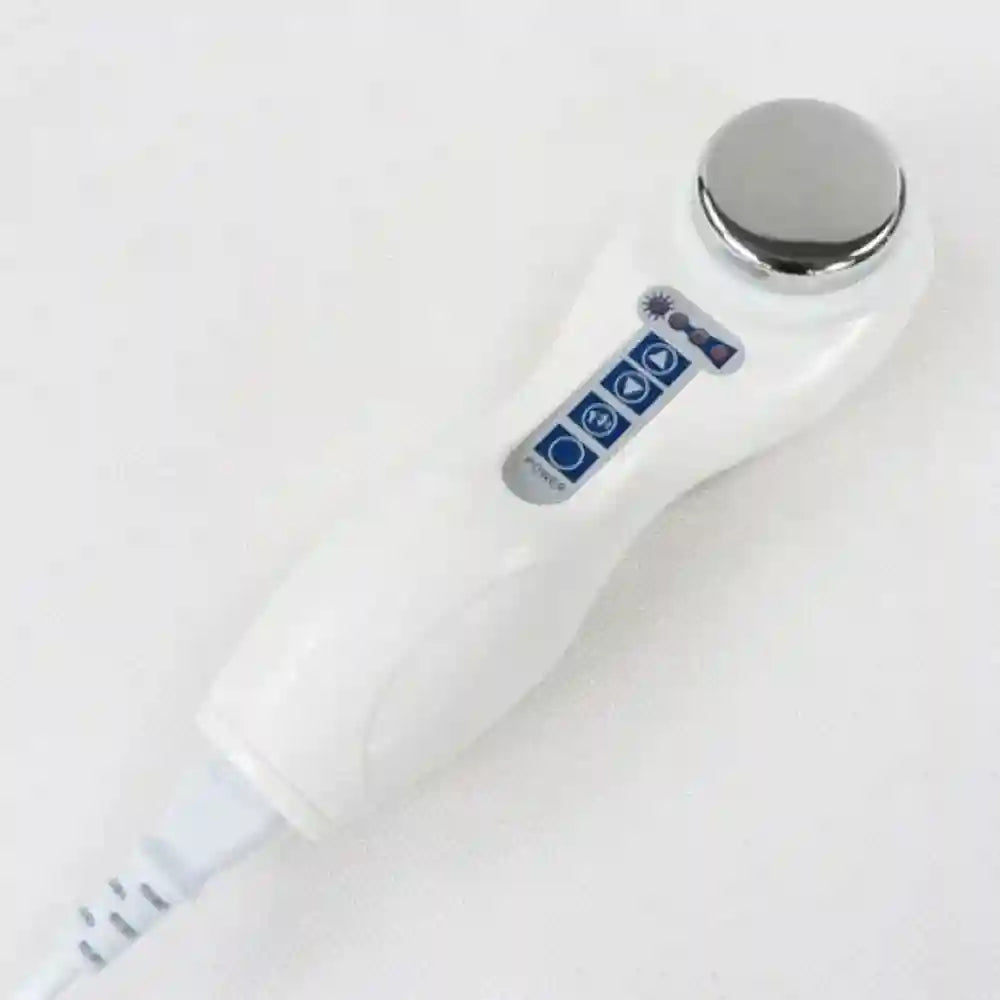 Portable white handheld ultrasound therapy device with metallic head for physiotherapy and home pain relief massage.