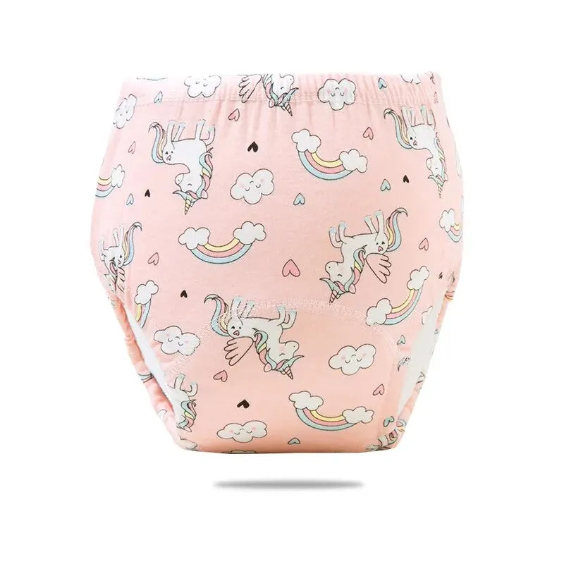 Pink baby training diaper with unicorn, cloud, and rainbow print for toddler potty training.
