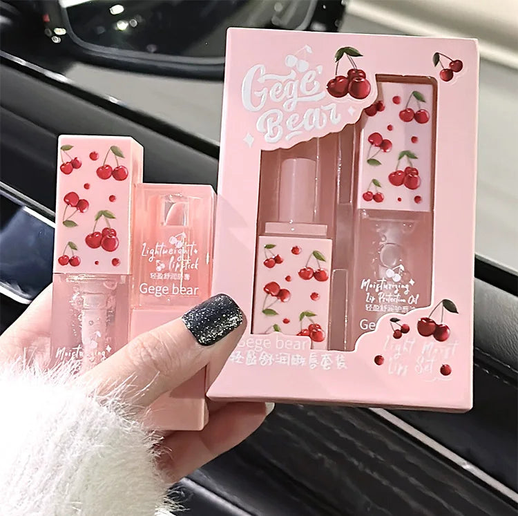 Gege Bear cherry lip balm and oil set in pink packaging. Moisturizing lip makeup for tender, glossy lips.