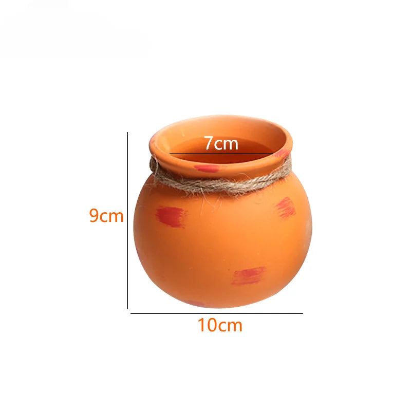 Orange ceramic hanging planter size: 10cm tall, 7cm wide bowl