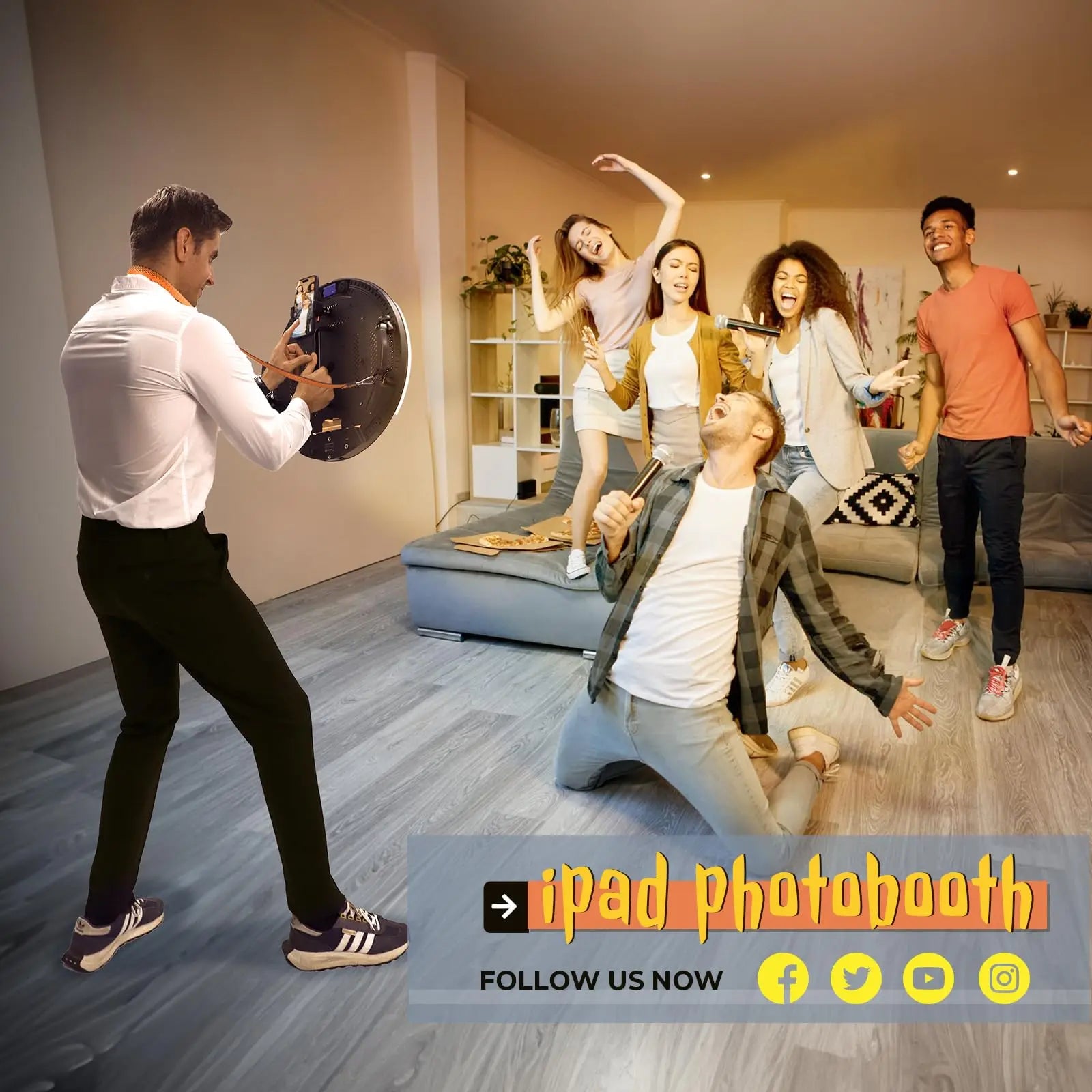 Handheld iPad photobooth with a round, black LED ring light being used to capture a group of people at a party.