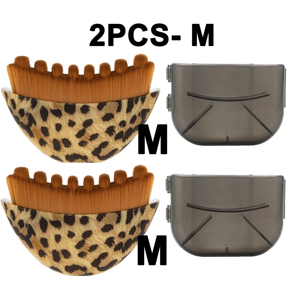 Two leopard-print facial massage brushes with brown bristles and two semi-transparent grey plastic protective covers.