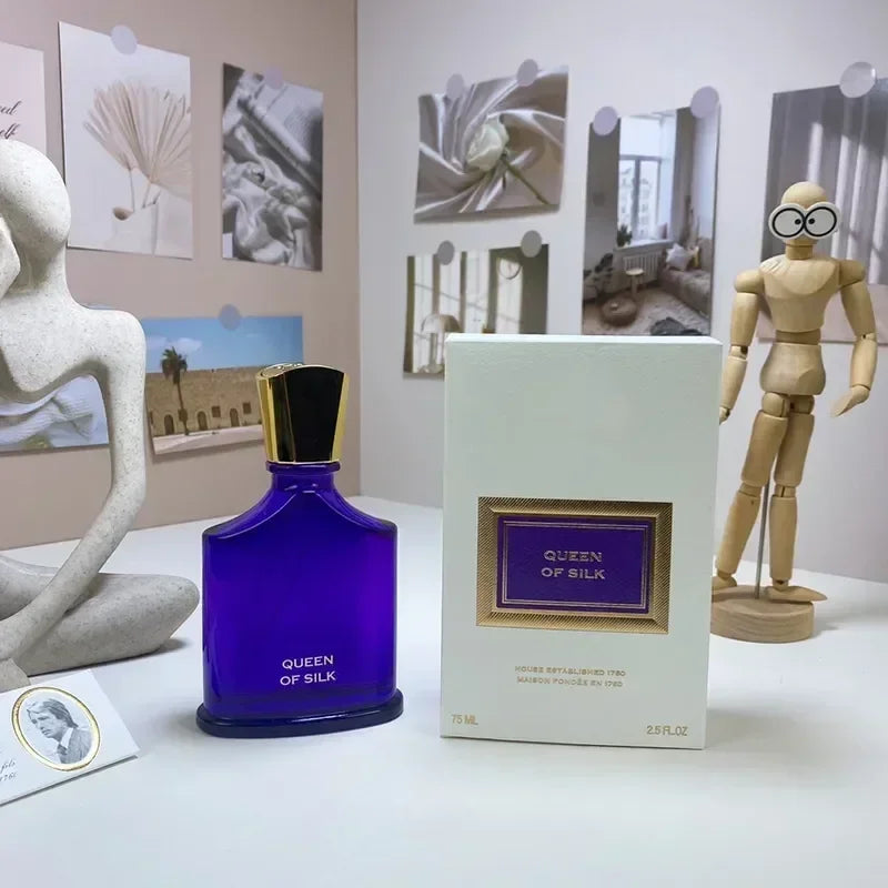 Queen of Silk EDP unisex perfume spray. Blue glass bottle with gold cap, 75ml luxury fragrance for men and women.