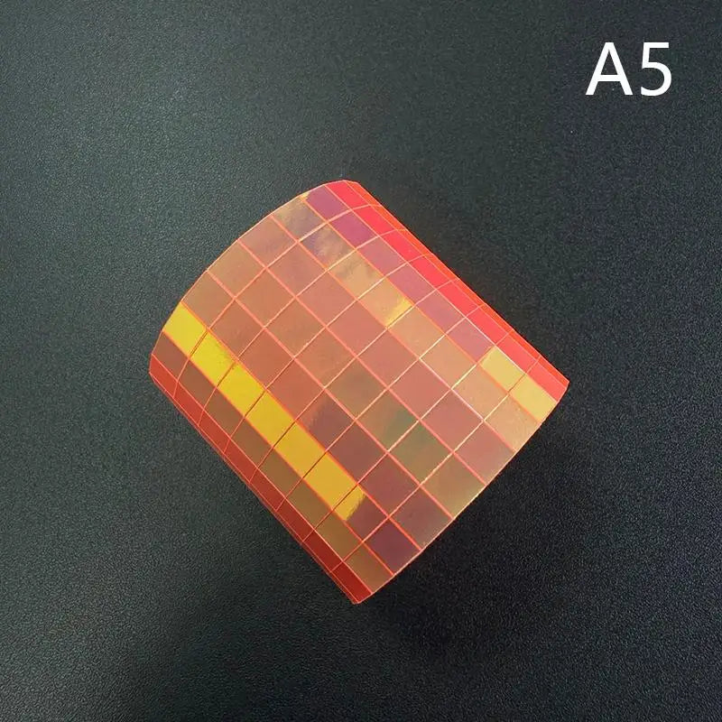 Self-adhesive mosaic glass tape swatch in orange and yellow gradient mirror tile grid