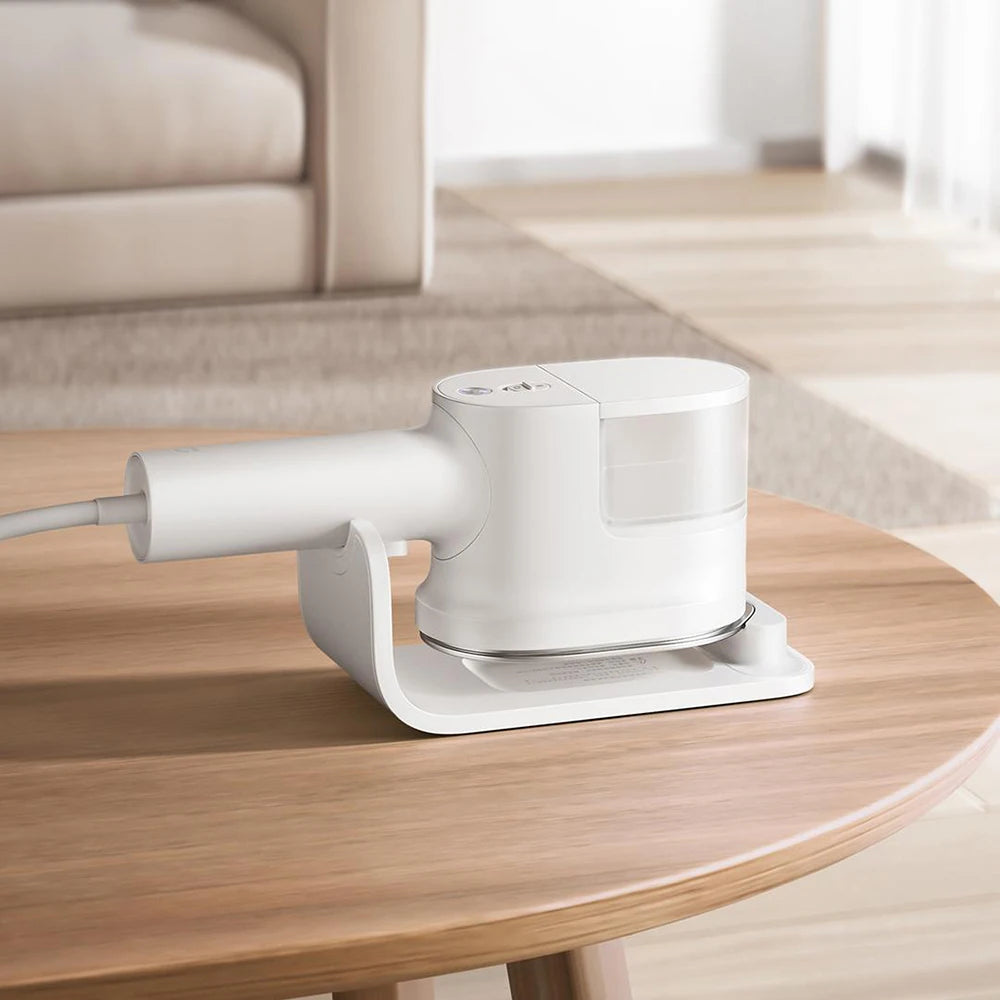 Tidesmit handheld garment steamer and electric steam cleaner for efficient mite removal and flat clothes ironing.